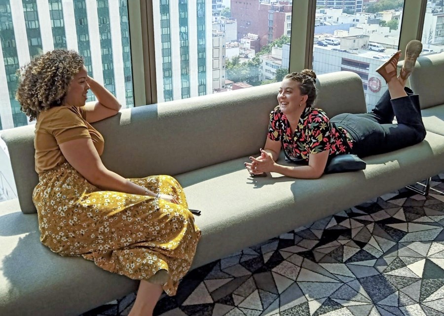 Women sitting on a couch talking