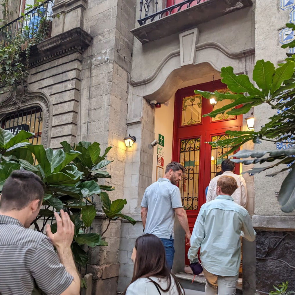 Group of people walking into building