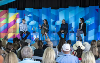 Food is Medicine panel on stage at Aspen Ideas Health 2025. They are seated on metal stools in front of a colorful backdrop. Far left, variations of wavering colors: orange, yellow, pink, green, blue, and purple. The rest of the backdrop are geometrical shapes in varying shades of blue with three prominent boxes with the title: Aspen Ideas Health in white lettering. Seated from left to right: Corby Kummer Executive Director, Food and Society Program, Aspen Institute Hilary Seligman Professor of Medicine, University of California San Francisco John Lumpkin President, Blue Cross and Blue Shield of North Carolina Foundation Wendy Slusser Associate Vice Provost, Semel Healthy Campus Initiative Center, University of California at Los Angeles