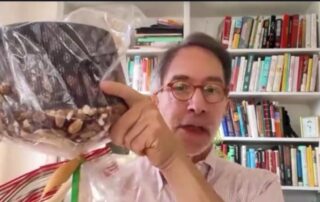 Corby Kummer holds up a panettone, a traditional Italian bread dessert made during the Christmas holidays.