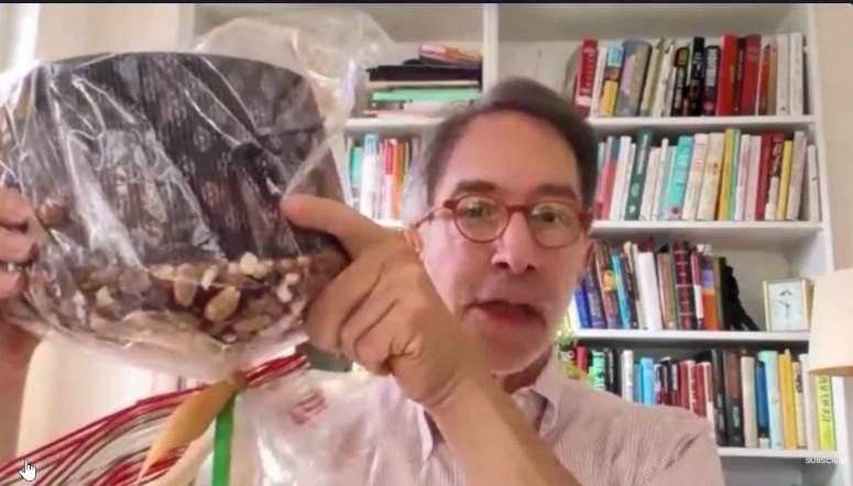 Corby Kummer holds up a panettone, a traditional Italian bread dessert made during the Christmas holidays.