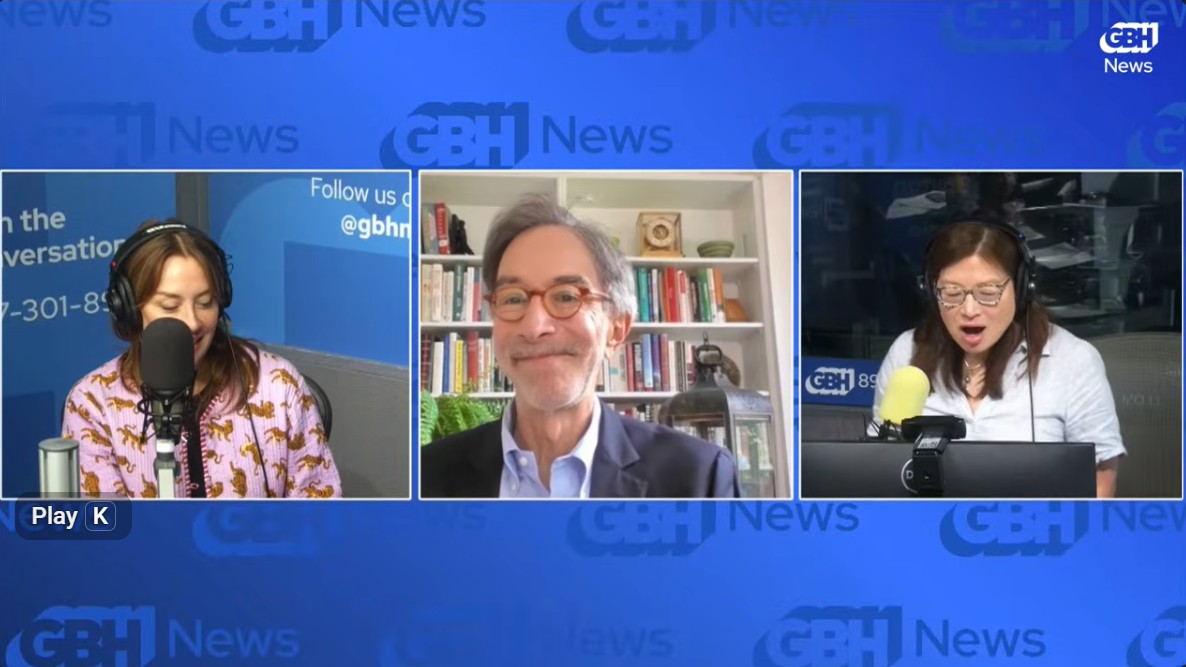 A screenshot of the YouTube livestream of Boston Public Radio from Monday July 20, 2026. Set against a blue background with the GBH News logo in the upper right corner. Three white-outlined images are set in the center, from left to right: Cristina Quinn, "Fighting Crime" podcaster and guest co-host, a woman with shoulder length brown hair and wearing a black sleeves less tank top behind a studio mic; Corby Kummer, a white male wearing glasses and a dark blue coat over a white collared shirt and smiling; and Shirley Leung, Boston Globe reporter and guest co-host, a woman speaking into the studio mic wearing a white and blue stipped button down shirt and wearing glasses.